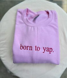 Born to Yap Sweatshirt, Embroidered Sweatshirt, Funny Statement Sweatshirt, Cozy Sweatshirt, Stylish Apparel, Dog Lover Gift Introducing our "Born to Yap" Embroidered Sweatshirt, the perfect blend of comfort, style, and personality. Whether you're a proud dog lover or just someone who loves to chat, this sweatshirt is a must-have addition to your wardrobe.  High-Quality Embroidery - **Intricate Design Beautifully embroidered with the phrase "Born to Yap." - **Durable Threads Ensures long-lasting Custom Embroidered Cotton Tops For Streetwear, Cotton Crew Top With Embroidered Text, Pink Crew Neck Top With Embroidered Logo, Pink Crew Cotton Top, Trendy Custom Embroidery Tops For Streetwear, Pink Relaxed Fit Top With Embroidered Logo, Pink Cotton Crew Top, Simple Crewneck Design, Pink Crew Neck Top With Embroidered Text