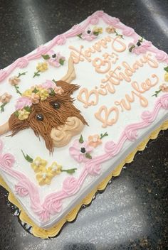 there is a birthday cake with a cow on it