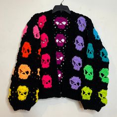 a colorful knitted sweater with skulls on it