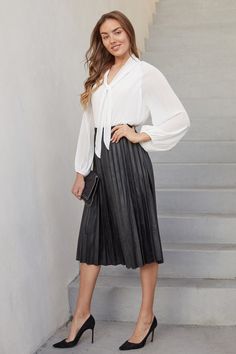 Faux leather pleated midi skirt. Perfect for cold months, layer with your fave turtleneck. Made in Italy. Shop women's bottoms for all occasions. Pleated Skirt Outfits, Women's Bottoms, Black Midi Skirt, Pleated Midi Skirt, Skirt Outfits, Pleated Skirt, Midi Length, Womens Bottoms, Midi Skirt