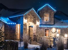 a house with christmas lights on its windows