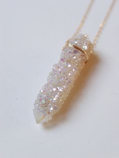 Featuring a single beautiful Angel Aura Spirit Quartz Raw stone which was handcrafted into a 14k gold filled bezel set pendant piece.The stone has a pretty natural sparkle.This necklace highlights the beautiful elements of this arresting stone. The stone measures approx. 1.25" long and 15mm wide. Chain is 18" long.This piece is a very limited edition so get it while it lasts.Please note each piece will vary in color, shape, size and crystalsIf you need a longer chain than please purchase my "UPG Spirit Quartz Necklace, Angel Aura Crystal, Raw Amethyst Ring, Crystal Stone Jewelry, Raw Crystal Necklace, Spirit Quartz, Aura Crystals, Angel Aura Quartz, Beautiful Angel