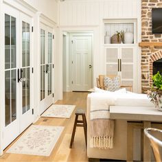 a living room filled with furniture and a fire place