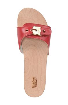 A smooth, natural beechwood footbed extends the vintage appeal of a handcrafted slide sandal finished with a buckle strap and nail-head rivets. 1 1/2" heel; 3/4" platform (size 8) Adjustable strap with buckle closure Contoured footbed for comfort and support Leather or textile upper and lining/synthetic sole Imported With the purchase of this shoe, Dr. Scholl’s will donate one tree to the nonprofit Trees for the Future, which provides opportunities for impoverished families to learn sustainable Cool Sandals, Dr. Scholl's, Black 13, Platform Slides, Sandal Women, Rivets, Leather Working, Slide Sandals, Slip On Sandal