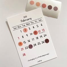 two calendars with numbers on them sitting next to each other in front of a white background