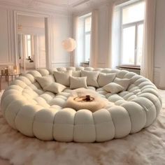 a white circular couch sitting on top of a fluffy rug