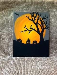 a painting of halloween pumpkins in front of a full moon with bats on it