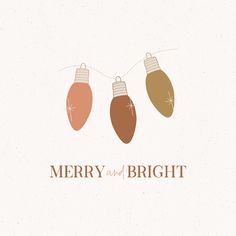 three christmas lights hanging from strings with merry and bright written on the bottom in brown