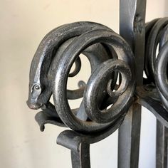 an iron gate with two circular rings on it