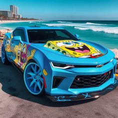 a blue chevrolet camaro painted with cartoon characters