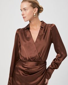 Made from 100% silk satin, the Nyla dress is a flattering long sleeve faux-wrap mini dress that features a collar with a v-neckline. This chic brown dress will be your new favorite date night staple. | Nyla Dress - Landslide Silk Satin | Size 14 Silk V-neck Mini Dress For Work, Silk V-neck Dress For Fall, Chic V-neck Satin Dress For Fall, Chic Satin Mini Dress With Surplice Neckline, Fitted Satin Dress With Surplice Neckline, Elegant Satin Wrap Dress For Work, Formal Fall V-neck Wrap Dress, Chic Silk V-neck Mini Dress, Fitted Satin Dress With Surplice Neckline For Formal Occasions