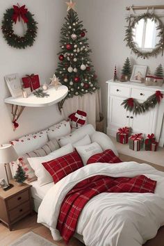 a bedroom decorated for christmas with red and white plaid bedding, wreaths and trees