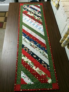 a kitchen counter with a quilted runner on it