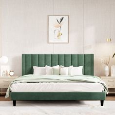 a bed with green headboard and pillows in a white room next to two nightstands