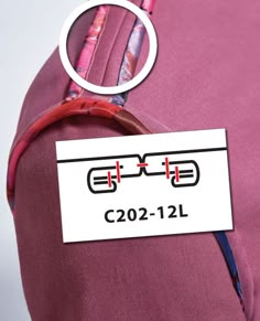 a close up of a bag with a tag on it