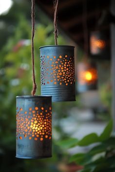 two tin can lights hanging from a string in the shape of stars and dots on them