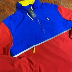 Pop Over Jacket Blue Color Block Long Sleeve Windbreaker, Red Color Block Long Sleeve Windbreaker, Red Color Block Outerwear For Spring, Red Long Sleeve Color Block Windbreaker, Spring Red Color Block Outerwear, Red Color Block Outerwear For Outdoor, Red Color Block Outerwear For Fall, Ralph Lauren Half Zip, Black And White Camo