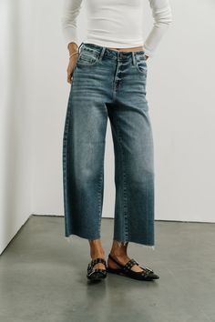 High Rise Denim Jeans Wide Leg Fit Button & Zipper Closure Cropped Fit Raw Hem Detail Stretch Material 93% Cotton, 5% Polyester, 2% Spandex Machine Wash Cold Inside Out, Tumble Dry Low Model Info Height: 5'8" Wearing Size: 25 Measurements: Waist: 28", Rise: 10.5", Inseam: 24.5" ~section 2~ SIZE WAIST RISE INSEAM 23 24" 10" 24.5" 24 25" 10" 24.5" 25 26" 10.5" 24.5" 26 27" 10.5" 24.5" 27 28" 11" 24.5" 28 29" 11" 24.5" 29 30" 11.5" 24.5" 30 31" 11.5" 24.5" 31 32" 12" 24.5" **For more specific infor Wide Cuff Jeans, Fall Fashion Trends Casual, Cropped Jeans Outfit, High Rise Denim Jeans, Jeans Wide, Denim Sweater, Loungewear Sets, High Rise Denim