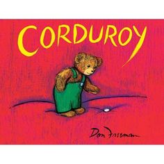 the teddy bear is sitting on top of a red book cover that says corduroy