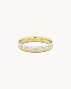 a yellow gold ring with white stones on the side and an inscription that reads'sendra scott '