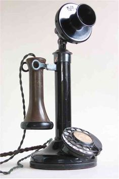 an old fashioned telephone with two dials on it