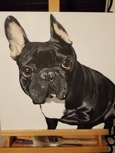 a painting of a black french bulldog on a white background with wooden easel and utensils