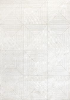 a white rug with an abstract design on it