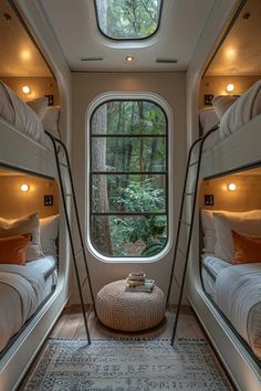 bunk beds in a room with round windows and lights on the ceiling, along with a rug