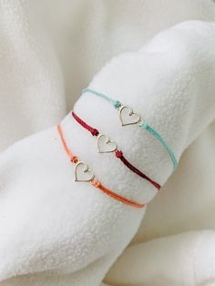 These heart bracelets are waterproof and great for anyone who is often doing outdoor activities. They would make a nice gift. Stack these together, with other bracelets, or wear them by themselves! They are perfect for everyday wear! ∙ ∙ ∙ ∙ ∙ ∙ ∙ ∙ ∙ ∙ ∙ ∙ ✦ MATERIALS ✦ * High-Quality Waxed Linhastia Polyester Cord (This cord is waterproof!) * Heart Charm ∙ ∙ ∙ ∙ ∙ ∙ ∙ ∙ ∙ ∙ ∙ ∙ ✦ SIZES ✦ These bracelets are adjustable from about 5.5 Inches to 8.5 Inches. They are made to order so if you need a custom size please let me know. I'm happy to do that for you. ∙ ∙ ∙ ∙ ∙ ∙ ∙ ∙ ∙ ∙ ∙ ∙ ✦ QUESTIONS/PROBLEMS ✦ If you have any questions, please feel free to ask! I hope to provide a positive experience for my customers. If you have any problems with your purchase, please let me know! I'll help howev Cheap Adjustable Friendship Bracelets For Women, Cheap Minimalist Friendship Bracelets For Best Friend Gift, Cheap Handmade Heart Friendship Bracelets, Cheap Adjustable Bracelets Suitable For Gifting, Casual Cheap Adjustable Friendship Bracelets, Cheap Minimalist Friendship Bracelets For Women, Cheap Trendy Heart Bracelet For Friendship, Cheap Minimalist Friendship Charm Bracelet, Cheap Heart Bracelet For Friendship