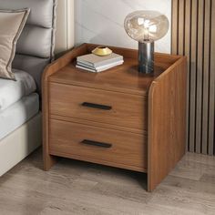 a night stand with two drawers and a lamp on top