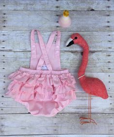 "This cute Flamingo Pink and Gold First Birthday Sunsuit is the perfect outfit for a first birthday party. -This unique Flamingo Pink and Gold Sunsuit is made with a pink cotton fabric with ruffle on the back. Size chart 0-3 months. 7-13 lbs. 17-24\" height 6 -9 months. 13-18 lbs. 24-261/2 \" height 12-18 months. 18-21 lbs. 261/2-31\" height 18-24 months. 21-24 lbs. 31-34\" height The colors of the outfit can be customized to fit your party. Appliqué can be changed also. Message me for more info Flamingo First Birthday, Bam Bam Costume, Pink And Gold First Birthday, Let's Flamingle, Gold First Birthday, Pink Cotton Fabric, Cute Flamingo, Flamingo Theme, Twin First Birthday