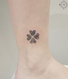 a small four - leaf clover tattoo on the right side of the ankle is shown