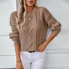 Enhance your autumn and winter wardrobe with our Women's Solid Color Twisted Pullover Sweater, a stylish nod to retro knitwear. This elegant sweater features a unique twisted knit pattern, adding texture and character to its simple, solid color design. Perfect for casual days or laid-back evenings, the soft, high-quality fabric provides warmth and comfort, making it ideal for layering or wearing on its own. The relaxed fit ensures a flattering silhouette while allowing for easy movement, and the classic crew neck offers a timeless appeal. Whether paired with jeans, skirts, or tailored trousers, this pullover transitions effortlessly from day to night, offering versatile style options. Embrace the cooler weather in comfort and style with this chic sweater, designed for the modern woman who Retro Knitwear, Chic Sweater, Elegant Sweater, Chic Sweaters, Round Neck Sweaters, Knit Pattern, Casual Streetwear, Tailored Trousers, Winter Sweaters