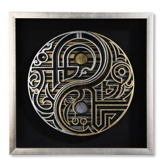 the letter s is made out of metal and has an intricate design in gold on black