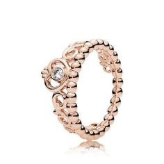 a rose gold beaded ring with a diamond