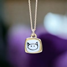 This teeny tiny love kitty necklace is adorable. It's very dainty and elegant with its velvety gold finish. It would make a great gift for the cat fanatic in your life.  Each piece gets 3 layers of kiln-fired enamel on top of cast sterling silver. I then apply the custom screen print made from my drawings straight from my sketchbook. Finally, the design is dipped in gold. Durable, adorable and unique!  Each pendant comes on a high quality gold filled chain, choose your length from the drop down Cute Gold Necklace With Cat Design, Cute Gold Jewelry With Cat Design, Gold Cat Design Charm Necklace As Gift, Gold Charm Necklace With Cat Design As Gift, Gold Charm Necklace With Cat Design For Gift, Cute Tiny Gold Charm Necklaces, Kitty Necklace, Glass Store, Modern Store