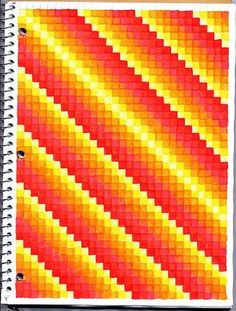 a spiral notebook with an orange, yellow and red pattern on the cover that has been made into a quilt