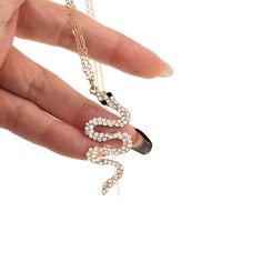 "High-Quality Jewels are the perfect gift for your loved ones or just for yourself! - Handmade item - Materials: Gold, Stainless Steel - Korean Jewelry - Cubic Zirconia - 18\"L+1.5\" extension  - Cable chain - Pendant size: 1.6\"H x 0.75W pave crystal, onyx cubic - Lobster Clasp" Metal Snake Shape Necklace As Gift, Snake-shaped Metal Necklace For Gift, Metal Snake-shaped Necklace For Gift, Rhinestone Crystal Necklace With Adjustable Chain For Gift, Gift Cubic Zirconia Rhinestone Necklace, Snake Shape Clavicle Chain Jewelry As A Gift, Gift Rhinestone Necklace With Adjustable Chain, Trendy Gold Rhinestone Necklace Gift, Adjustable Rhinestone Necklace As Gift