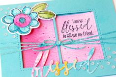 a close up of a card with a flower on the front and words below it