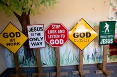 there are many different signs on the wall in this room, including jesus is the listener to god and walk with jesus