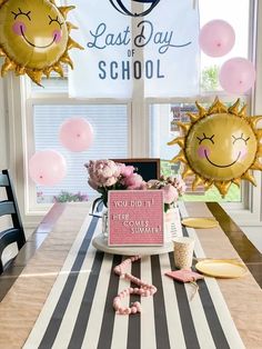 a decorated table with balloons and decorations for a last day of school luncheon party