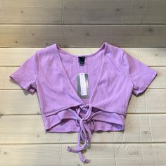 Women’s Wild Fable Short Sleeve Double Tie Versatile Light Lavender Crop Top Nwt Purple Stretch Crop Top With Short Sleeves, Fitted Lavender Short Sleeve Top, Purple Stretch Crop Top, Purple V-neck Top For Summer, Purple Stretch Top For Spring, Purple Stretch Tops For Summer, Spring Stretch Purple Top, Fitted Lavender Summer Top, Fitted Lavender Top For Summer