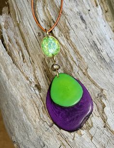 Handmade and bold. Available in several colors and easily Adjustable. https://www.etsy.com/listing/1507275175/colorful-handmade-tagua-nut-pendant Adjustable Multicolor Jewelry With Large Pendant, Natural Color Hand-strung Necklaces With Round Beads, Adjustable Nickel Free Resin Necklace, Unique Adjustable Purple Necklace, Adjustable Nickel-free Resin Necklace, Tagua Nut Jewelry, Adjustable Hand-strung Orange Necklaces, Unique Hand-strung Orange Necklace, Orange Agate Hand-strung Beaded Necklaces