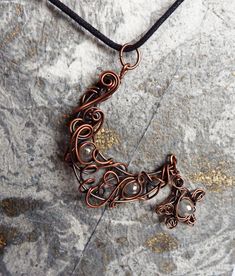 "This Copper Wirework Crescent Moon Necklace with rainbow titanium agate beads and star is such an unusual piece of jewelry and is a real statement piece. It has been oxidised to enhance the twists and turns of the copper wirework and brings out the sparkle of the beads. This will be your next go to necklace and comes on a 18\" cord making it great for layering. Great Gift for your Witchy Friend Original Gift for your wife on your 7th Anniversary together Beautiful Goth Christmas Gift Your penda Adjustable Wire Wrapped Magical Jewelry, Adjustable Star-shaped Magical Jewelry, Unique Metal Necklace With Moon Charm, Unique Handmade Star Necklace, Celestial Star Jewelry For Festival, Handmade Star-shaped Metal Jewelry, Celestial Star-shaped Festival Jewelry, Bohemian Moon Phase Copper Jewelry, Celestial Festival Star Jewelry