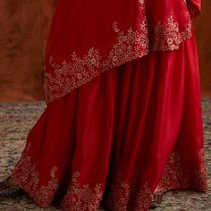 Pre Wedding Vibes - Red one shoulder silk cape with delicate embroidery teamed with matching embroidered sharara pants Composition: Kurta and Sharara- Dupion Silk Care: Dry Clean Only and Vacuum Storage This product can be customised for sleeves, length of blouse and neckline Delivery : 4-6 weeks as the product is hand crafted. For more information and sizes please contact fabiliciousfashion@gmail.com or visit our Copenhagen studio.About the Designer : Pink City by Sarika, established in 2014, i Embroidered Sharara, Embroidered Cape, Silk Cape, Sharara Pants, Pink City, Vacuum Storage, Delicate Embroidery, Dupion Silk, Sharara Set