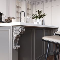 a kitchen with an island and bar stools next to the counter top in front of it