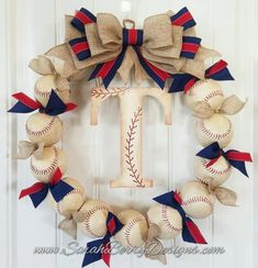 a baseball wreath with the letter t on it