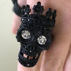 New Crystal Rhinestone Pave Crown Skull Stretch Ring. Black Color. Size: 1.5” H. Stretchable. Thanks For Viewing! Punk Style Black Skull Ring Gift, Black Skull Ring For Halloween, Gothic Black Rings With Skull Print, Gothic Black Skull Ring For Halloween, Black Metal Skull Ring As Gift, Black Metal Skull Ring Gift, Adjustable Black Punk Skull Ring, Black Metal Skull Ring For Gift, Halloween Black Skull Ring