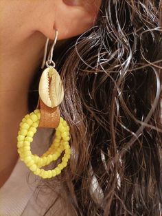 Handmade leather earrings, with cowries and seed beads. The sea is always my source of inspiration to create my jewelry, I collect shells myself during the summer, contact with nature is something that fascinates me There are two color options, black and yellow. Please note that due to lighting effects, monitor's brightness, contrast and other settings, there may be some slight differences in the color tone/shade of the photo. Please review our shop policies before purchasing. By purchasing Aleo Handmade Cowrie Shell Earrings For Beach, Bohemian Adjustable Cowrie Shell Earrings, Handmade Cowrie Shell Earrings For Vacation, Unique Beaded Drop Earrings For Beach, Dangle Cowrie Shell Earrings For Beach, Handmade Bohemian Cowrie Shell Earrings, Handmade Beaded Earrings For Beach, Nickel-free Yellow Jewelry For The Beach, Bohemian Cowrie Shell Earrings For Summer