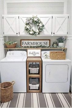 a white washer and dryer sitting next to each other in a laundry room